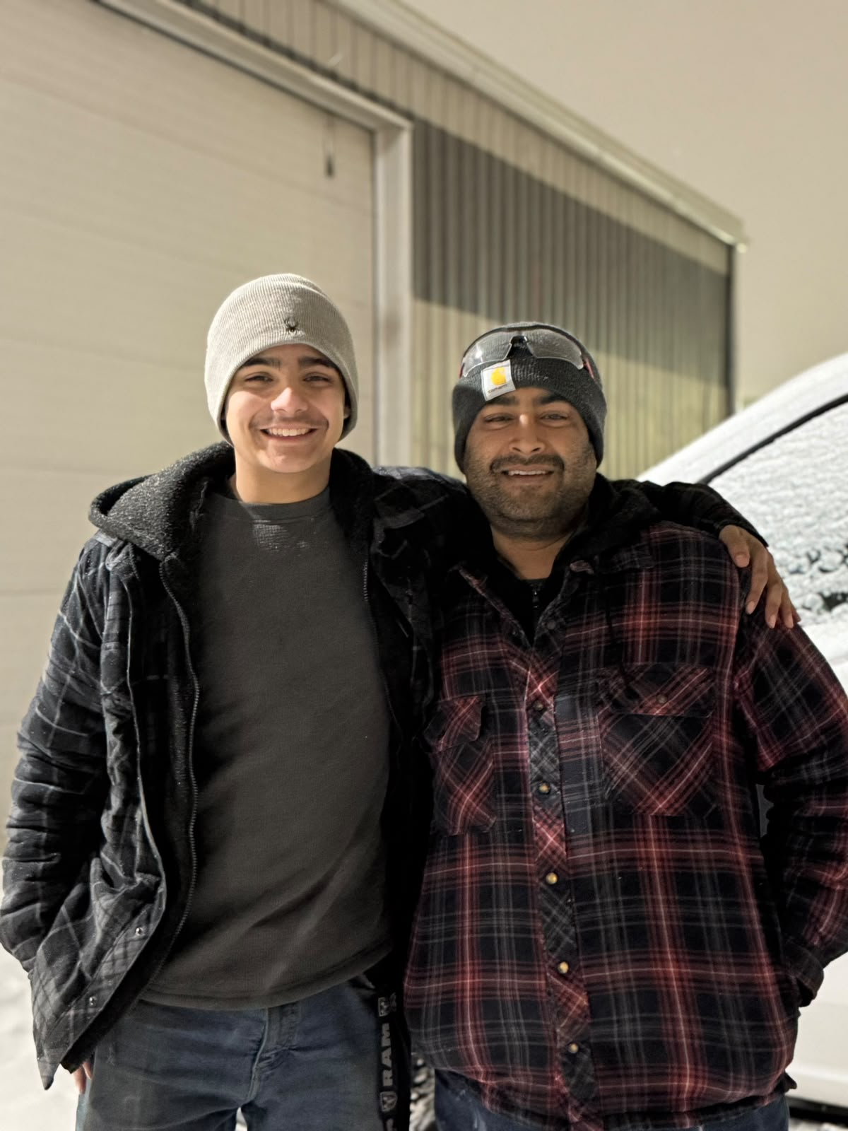 Happy Orange Auto customer with their vehicle